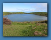 After a steep uphill hike, we encounter El Junco Lagoon,
the only fresh water lake in the Galapagos Islands.